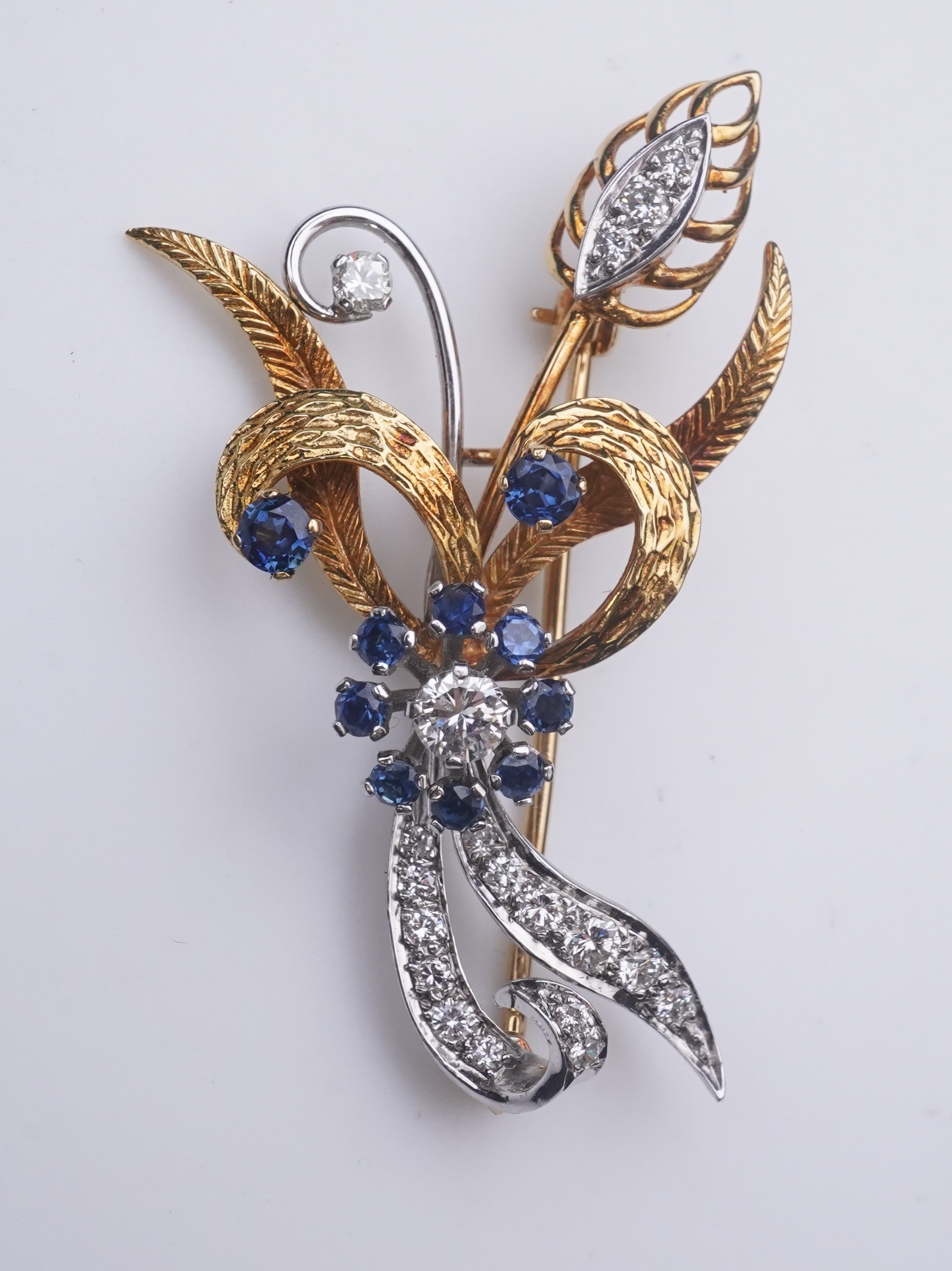 A sapphire and diamond brooch, third quarter 20th century